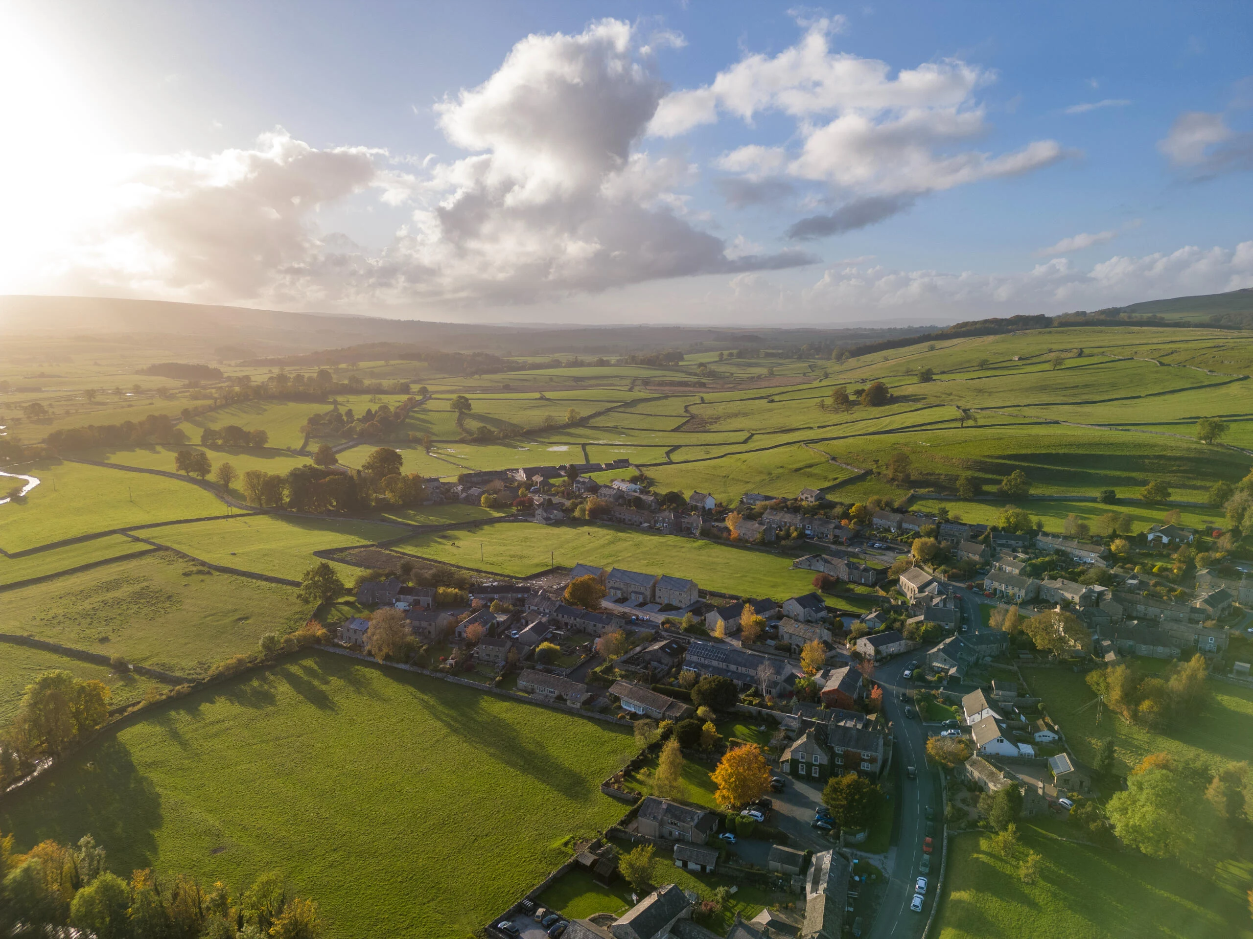 Aerial view of traditional stone cottages and village nestled in the Yorkshire Dales